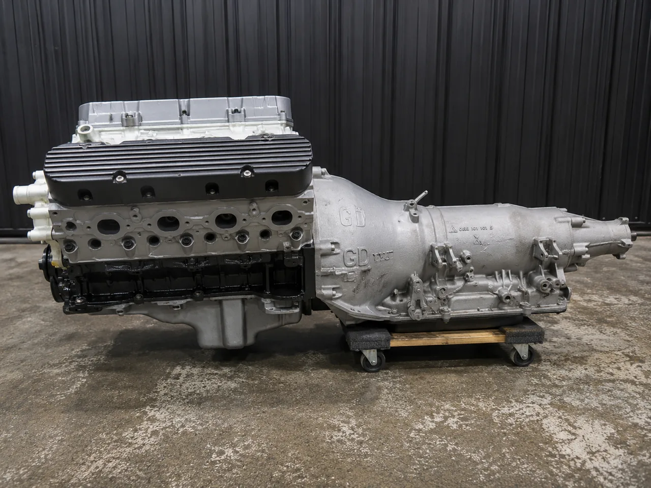Rebuilt engine mated to a transmission on a shop dolly