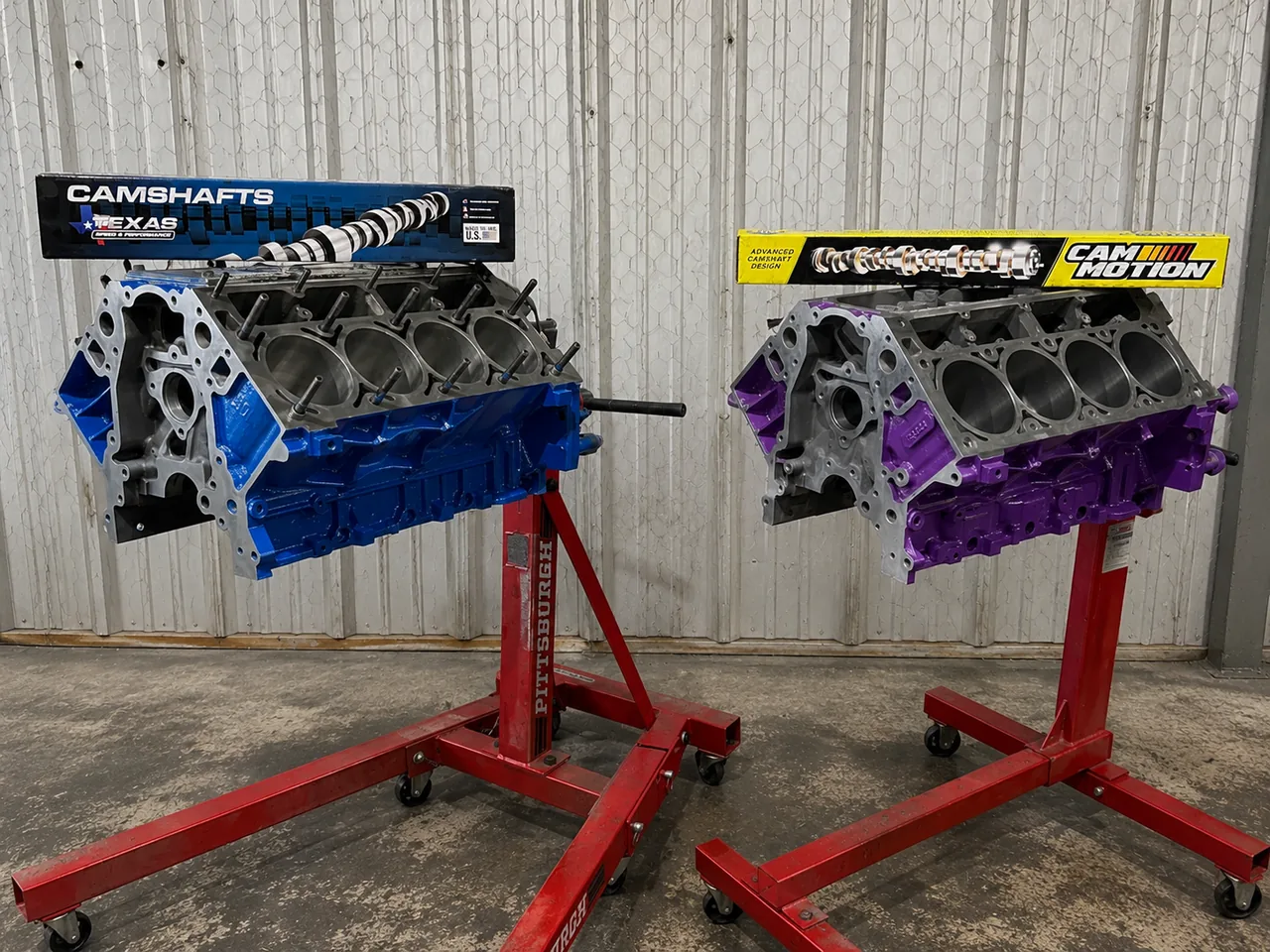 Two painted short blocks on engine stands with new camshafts
